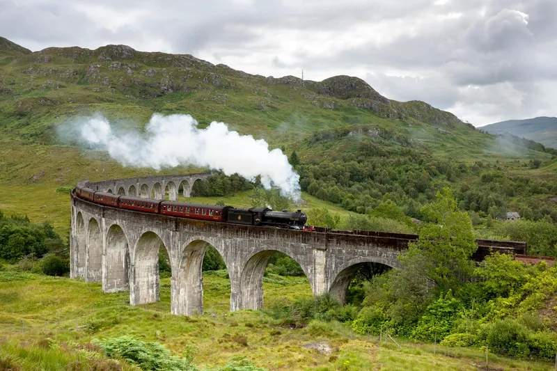The Jacobite Steam Train on the Glenfinnan Viaduct on a 2-day Highlands tour with Hogwarts Express from Edinburgh, Scotland